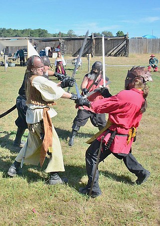 Demonstrators show off their sword-fighting skills during the 2013 Central Missouri Renaissance Festival. (Fulton Sun photo)